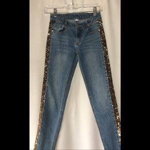 Blue denim jeans with reversible sequins